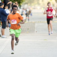 First place finisher Sydney Gidabuday, 17, of Orange checks his watch as he approaches the line and crosses with a time of 15 minutes 24 seconds during the Chapman University 5K Run/Walk in Orange Saturday. Following in second place is Matthew Klein, 22, of Pomona finished in 15 minutes 29 seconds.



////ADDITIONAL INFO:  -   01_chapman5k.1006.ks   -  Day: Saturday - Date: 10/5/13  -  Time: 7:47:16 AM  -   Original file name _KSA2273.NEF  -  KEN STEINHARDT, ORANGE COUNTY REGISTER --